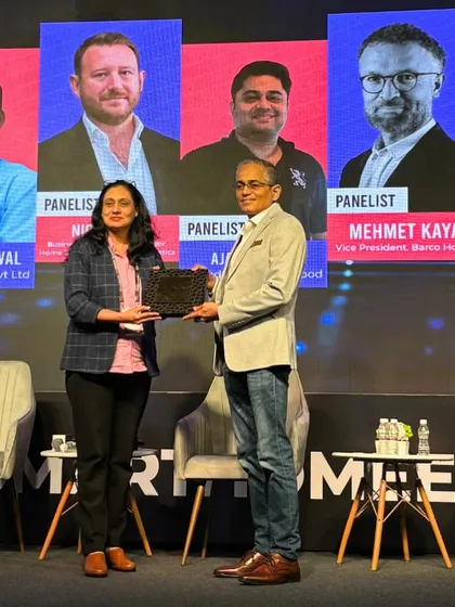 Our founder, Manmohan Ganesh, being recognized for his contribution to a panel discussion at the Smart Home Expo. We actively participate in industry dialogues, sharing our decades of expertise.