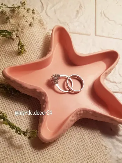 Another view of the peach starfish tray, showing its delicate texture and shape.