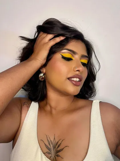 A duplicate image for context. A close-up showing the texture of the yellow eyeshadow.