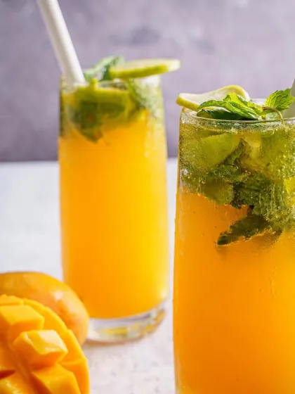 A refreshing mango mojito, styled with fresh mint and lime. We create beverage photography that looks cool, crisp, and perfect for a summer menu.