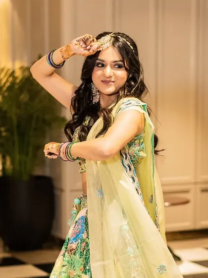 A bride looking absolutely radiant during her mehendi performance. Her expressions and graceful hand movements made the dance truly special.