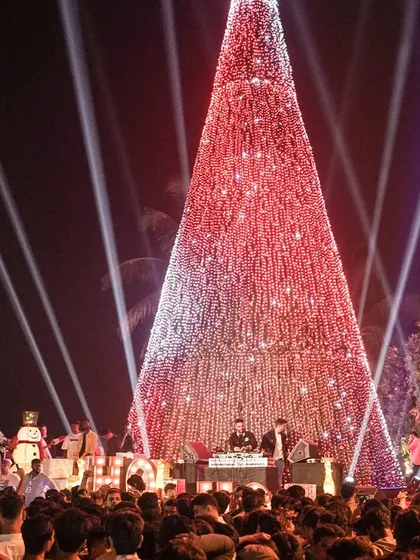 A wide shot of the massive Christmas tree and stage at Bandra Wonderland. We turned this public space into a giant open-air party, bringing the festive spirit to thousands of people.