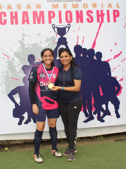 A top performer from our girls' team receiving her medal at the Hasan Memorial Championship. We believe in recognizing and celebrating the hard work of our players.