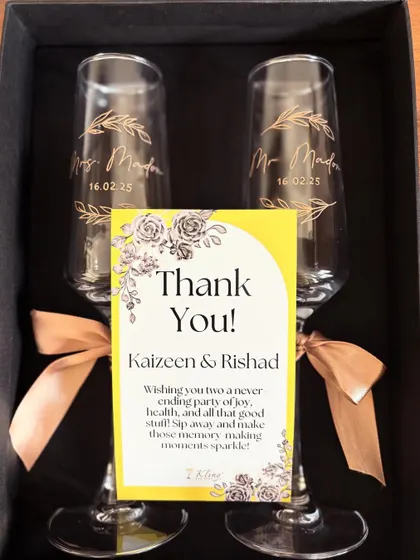To celebrate the happy couple, we created these elegant, custom-etched champagne flutes. It's a beautiful keepsake for the bride and groom to remember their special day with every toast for years to come.