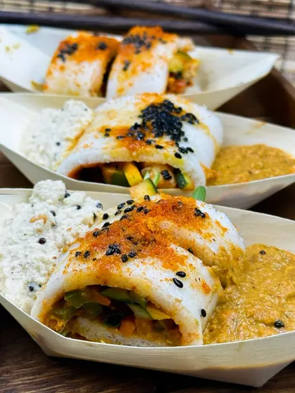 A true fusion masterpiece, my Sushi Idli combines the best of Japanese presentation with South Indian taste. Soft idli is rolled with fresh vegetables and served with coconut chutney and podi masala.