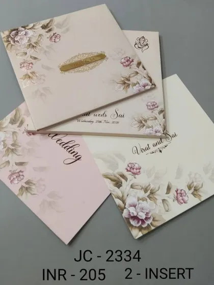This invitation features a soft, watercolour-style floral print in shades of pink. The design is delicate and romantic, with inserts for your wedding and other events.