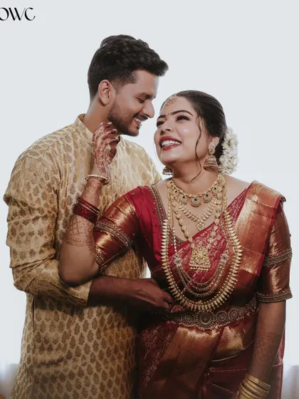 A candid and joyful moment between a bride and groom, filled with laughter and love.