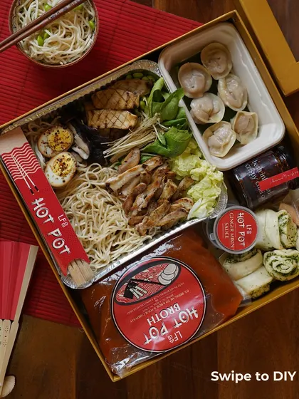 This image shows the complete Hot Pot kit in its beautiful packaging. You can see the broth, chicken, dumplings, noodles, and veggies neatly arranged, ready for you to unbox and start cooking.