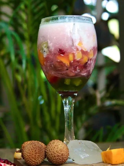 Our Ice Kachang is the perfect dessert for a hot summer day. It's a refreshing mix of crushed ice, red beans, and tropical fruits, drizzled with coconut mylk for an authentic, cooling flavor.