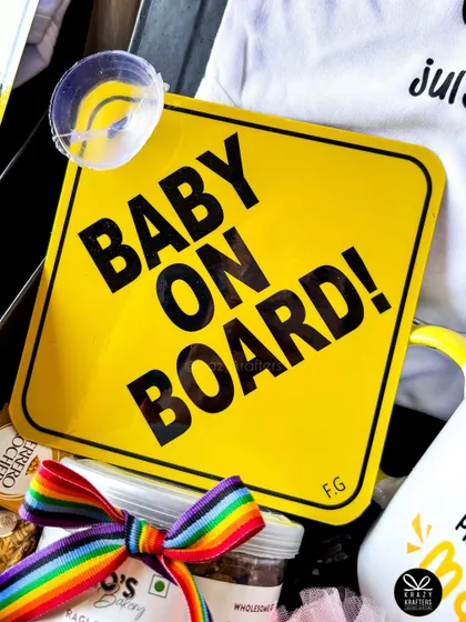 The iconic 'Baby on Board' sign, a fun addition to any pregnancy or baby-related hamper, perfect for the family's car.