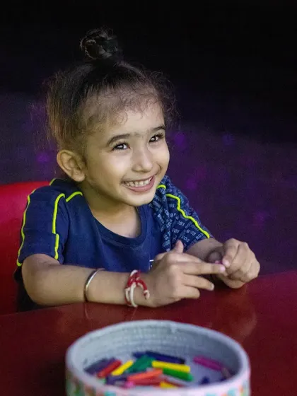 The ear-to-ear smile you get when you're about to create something amazing at our digital drawing station.