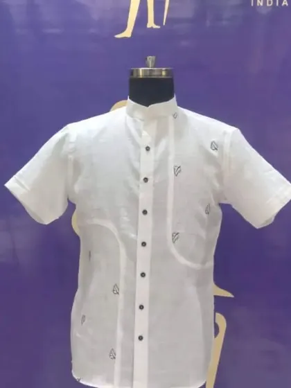 Simplicity at its best. This custom white short-sleeve kurta is made from breathable linen and features subtle embroidery and unique pocket designs for a relaxed yet stylish look.