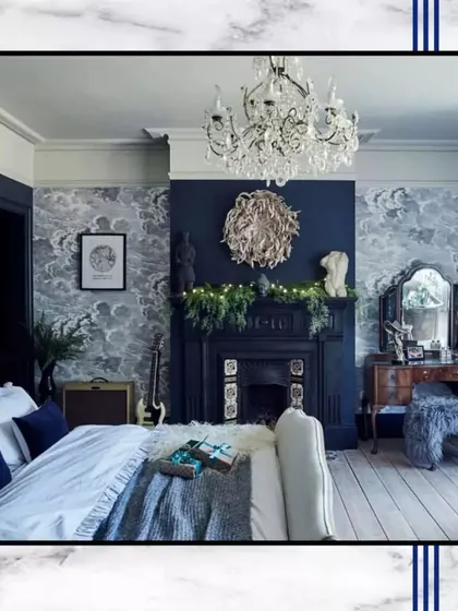 A cozy and chic bedroom design to elevate your sleeping space. This concept blends classic elements like a fireplace and chandelier with modern wallpaper for a unique, personal oasis.