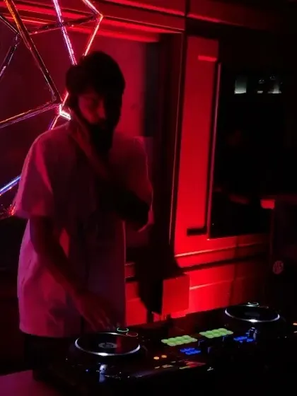 A shot of me at the decks during the 'Back 2 Skool Jam'. The red lighting and intimate setting were perfect for a night of classic hip hop and R&B.