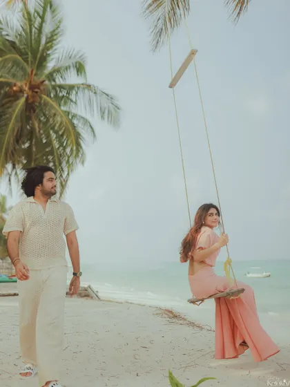 A quiet walk along the shore in Goa. The soft light and gentle waves create a peaceful and romantic setting for this candid couple photograph.