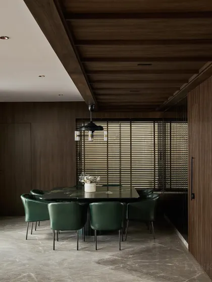 The centerpiece of the dining room is this 8-seater square table crafted from a rare Brazilian quartzite with a leathered finish. Paired with deep green leather chairs, it creates a rich, earthy, and luxurious dining experience.