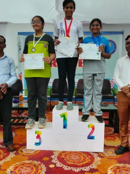 Seeing my students on the podium is the ultimate goal. These archers are celebrating their victory, holding their certificates and medals after a successful competition.