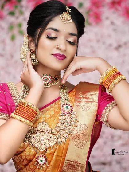 A stunning portrait from a collaborative photoshoot. This look features dramatic eye makeup and a bold pink lip, showcasing a more high fashion bridal style.