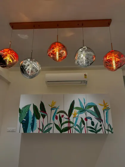 Another view of the completed crockery unit mural, showing how it looks with the warm glow of the lights in the evening.