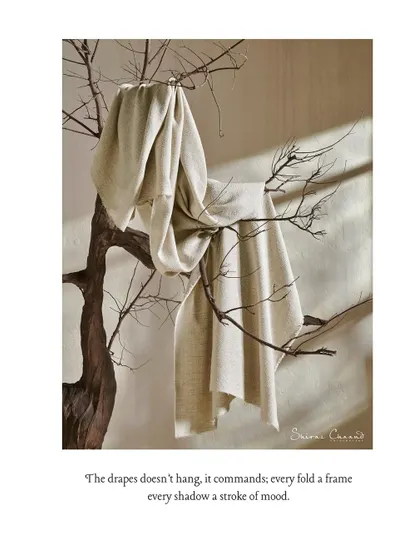 A close-up of the fabric from the previous shot, draped delicately on the branches of the tree. This highlights the texture and softness of the material in an unexpected, artistic way.