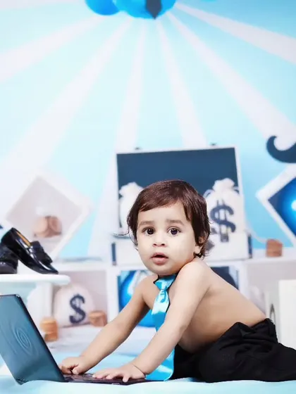 A curious 'Boss Baby' playing with a laptop in our fun office-themed set.