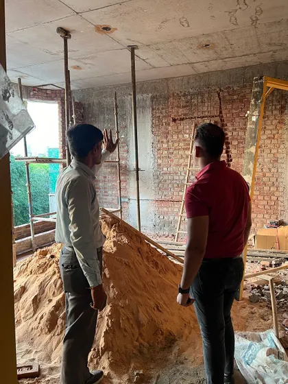 I am reviewing the bricklaying work with my team. Consistent quality in every brick and mortar joint is important for the building's strength and appearance.