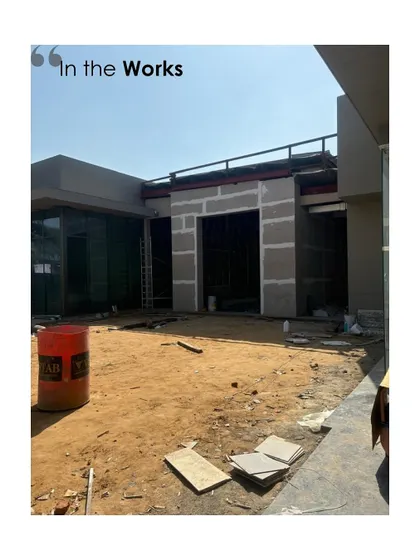 An exterior view of a project under construction. This image shows the raw structure before the facade and landscaping are complete, offering a glimpse into the scale and context of the building.