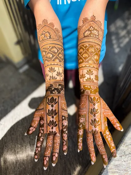 The complete view of the lotus and elephant themed bridal mehendi, showcasing a popular and auspicious combination for South Indian brides.