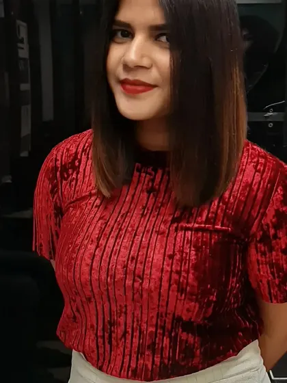 A chic makeover featuring a sharp bob haircut and a subtle ombre effect. The color gradually transitions from dark roots to lighter brown ends for a modern, stylish look.