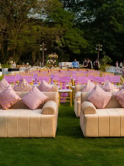 Another view of the plush lounge seating areas arranged on the lawn, providing guests with a comfortable and stylish space to relax and socialize.