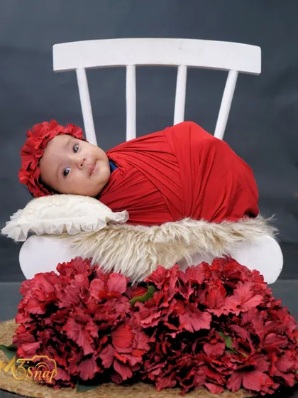 A hint of a smile from this adorable baby. These little expressions are precious, and I'm always ready to capture them.