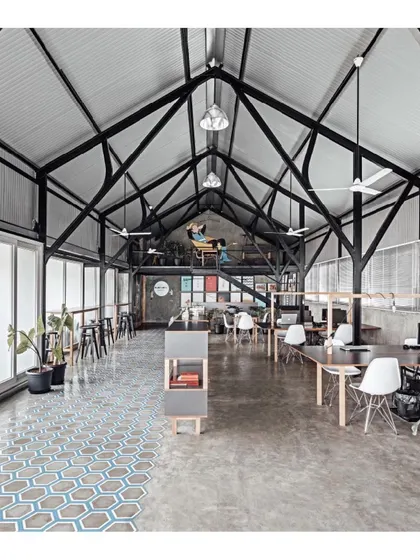 This is my own design studio, a space I created to be open, collaborative, and inspiring. The industrial warehouse structure is balanced with patterned floor tiles and plants, reflecting my philosophy of blending raw forms with thoughtful details.