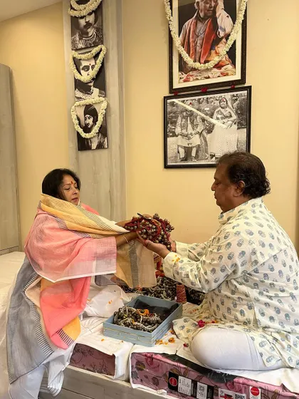 Guru Maa Smt. Ruby Mishra receiving blessings from Guru ji during the Guru Purnima puja, a beautiful representation of mutual respect within the tradition.