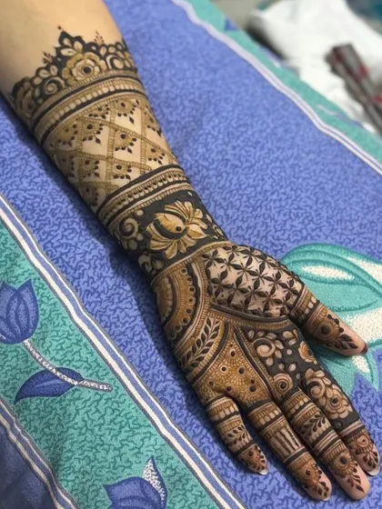 This is a detailed view of my intricate bridal henna work. Each design is unique, combining traditional patterns like paisleys and mandalas with fine-line fillers to create a stunning, full-coverage look for your special day.
