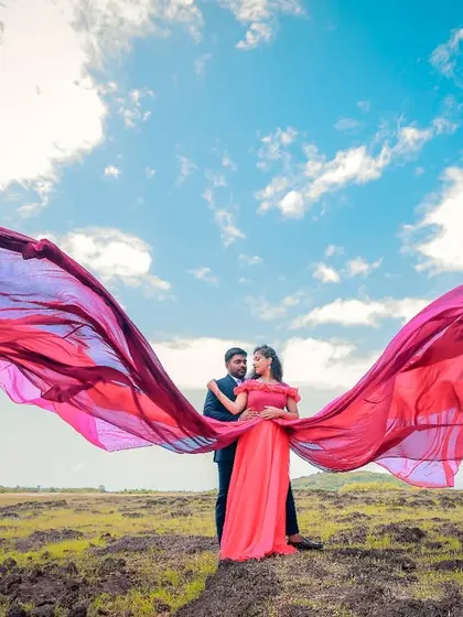 A wide-angle shot showing the incredible spread of this two-toned flying gown against the sky. This is how I create truly epic pre-wedding photos.