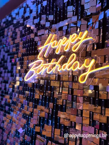 There's nothing like the sparkle of a shimmer wall. Here is a close-up of a custom neon sign against a gold sequin backdrop, creating a warm, inviting glow that makes any celebration feel extra special. This is a fantastic option for an anniversary or milestone birthday party.