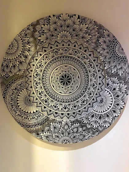 This unique project was a challenge I loved. The concept of a layered mandala, where one circle sits atop another, creates a modern and dynamic look.