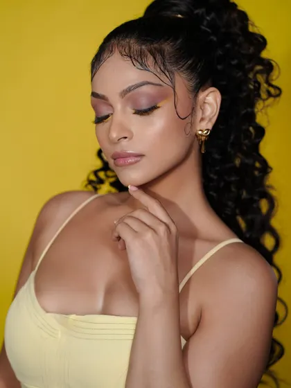 A serene and beautiful close-up from our summer campaign. This shot highlights the soft, blended eyeshadow and the glowing, dewy finish of the skin.