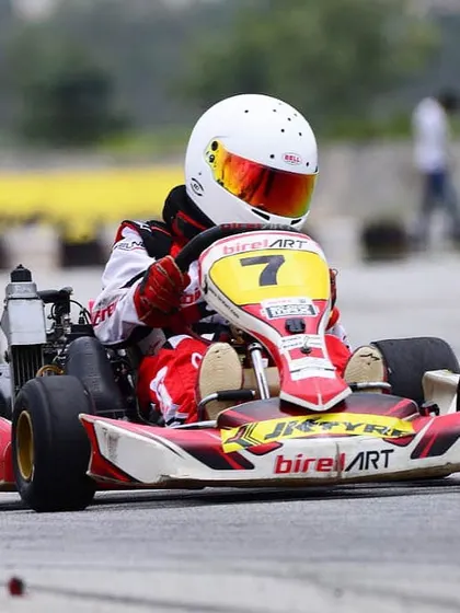 Another shot of our driver in kart number 7, fully committed through a corner during a national championship race.