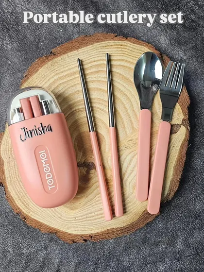 Here you can see the full portable cutlery set, including the stainless steel chopsticks, spoon, and fork. The pieces fit neatly inside the compact, personalized travel case.