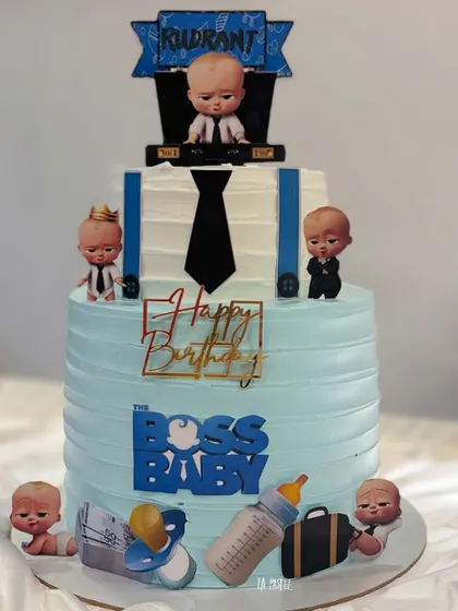 Who's the boss? This Boss Baby themed cake is perfect for a little one's birthday, decorated with characters from the movie, a tie, and suspenders.