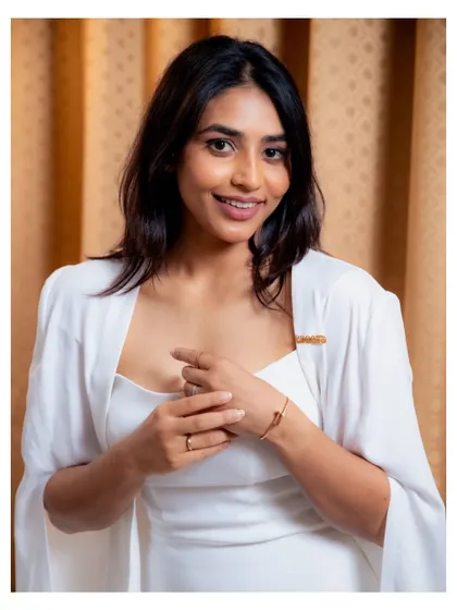 A close-up of Sapthami Gowda, looking serene and beautiful in her custom white gown for the SIIMA awards.