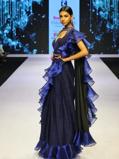 The movement of the organza ruffles on this blue saree gown is truly captivating. It’s a hassle-free, high-fashion alternative to a traditional saree for any formal event.