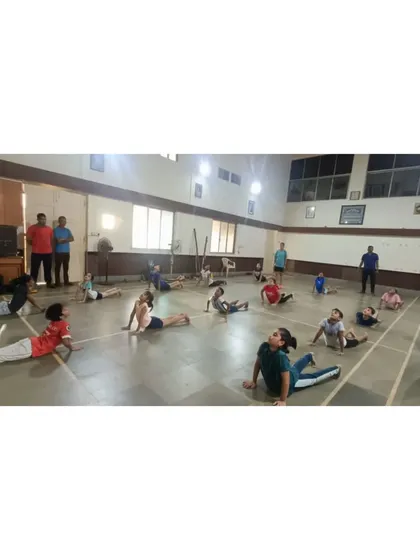 Our students practicing the cobra pose during our International Yoga Day celebration. We believe flexibility and core strength are essential for preventing injuries and improving performance.