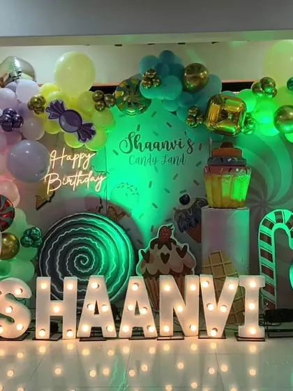 A green-lit variation of the Candyland theme for Shaanvi's birthday, showing how we use colored lighting to change the mood of the setup.