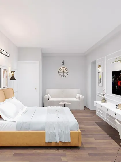 A render of a spacious and serene master bedroom with a seating area, a TV unit, and large windows for a bright and airy feel.
