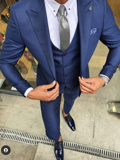 I also specialize in formal wear. This is a perfectly tailored three-piece suit in a striking shade of blue that I can create for your formal events or wedding receptions.