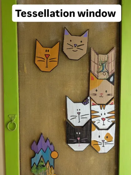 A look at our tessellation window, made from an old window frame and magnetic, cat-themed tiles. It's one of the many upcycled art pieces you'll find at our lab.