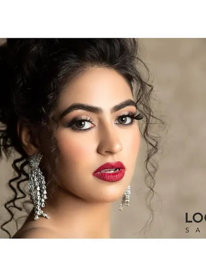 We create bold and glamorous looks perfect for any party or special event. This features a classic red lip, dramatic winged eyeliner, and luminous skin, a combination designed to make a powerful statement and turn heads.
