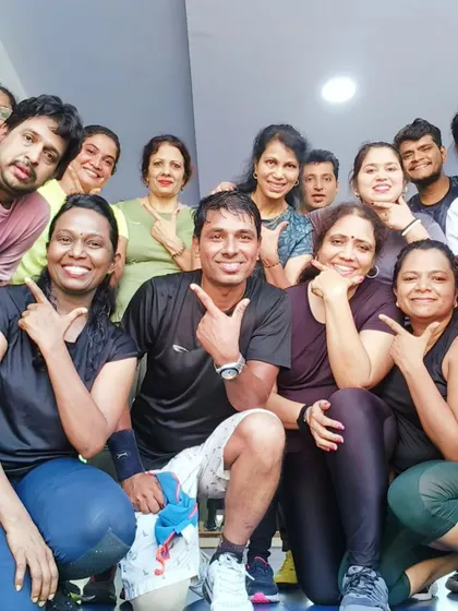 Another fun group pose showing the playful side of our fitness family. We never take ourselves too seriously.